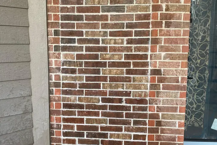 Brick chimney wall with repointed mortar joints