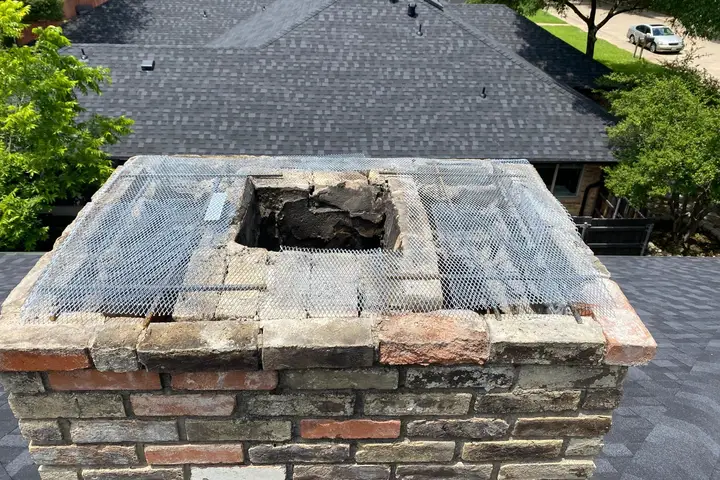 Mesh screen fitted on a chimney top to keep animals out