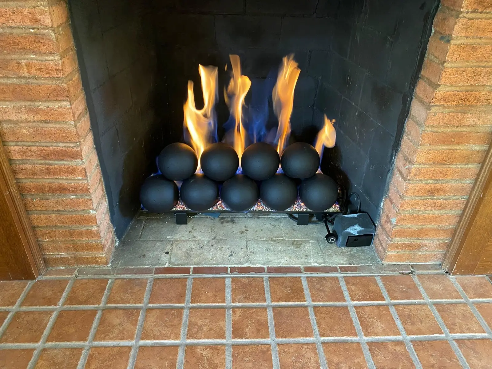 Repaired fireplace burning with ceramic fire balls