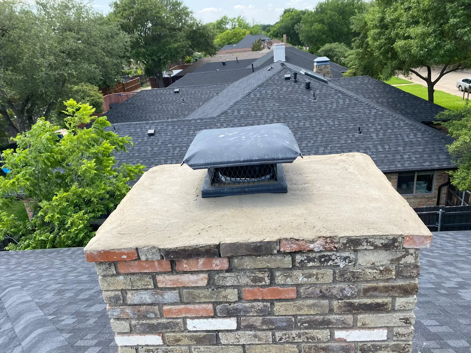 Crownline Chimney Sweep crew on an Arlington rooftop