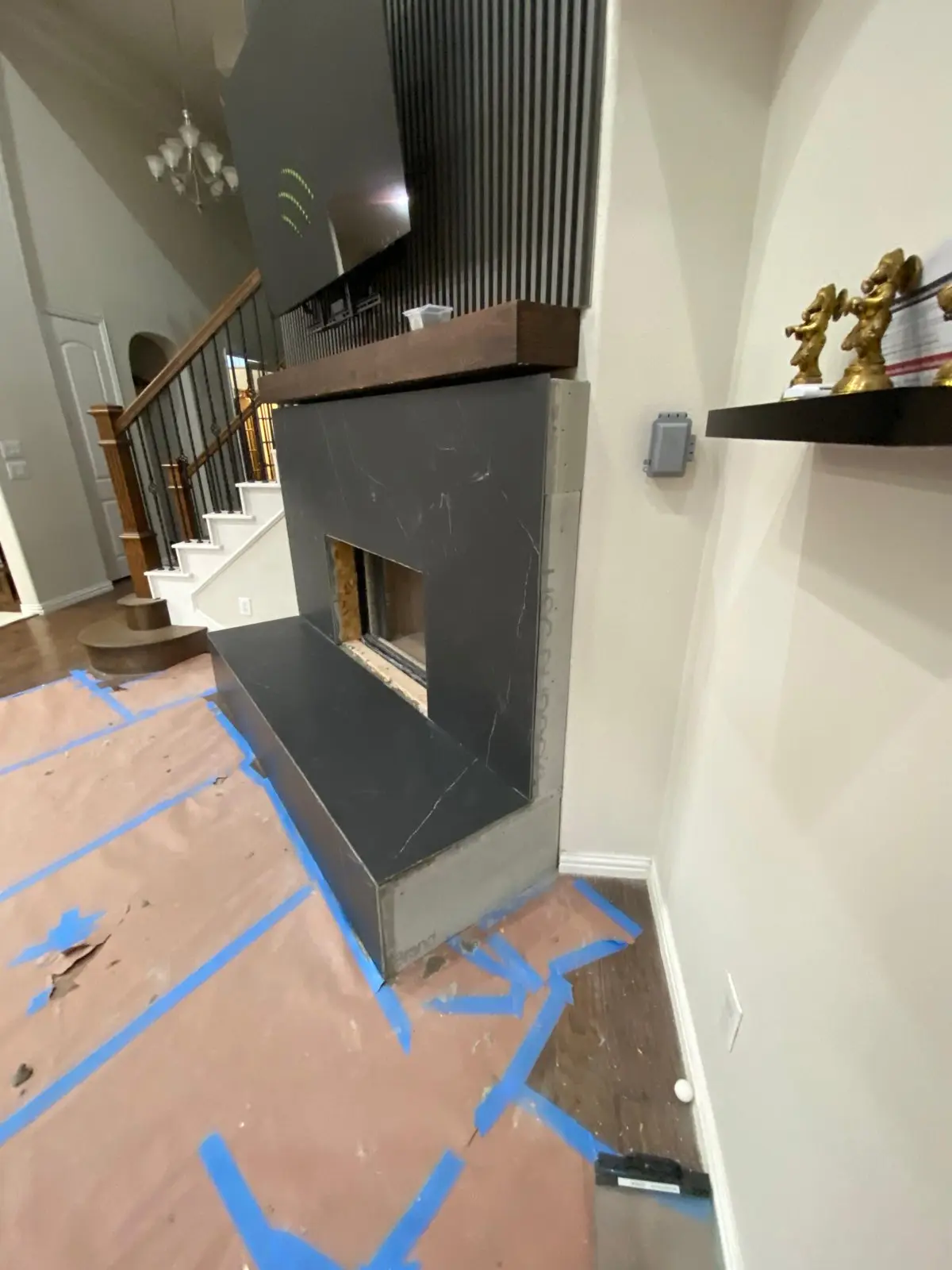 Remodeled fireplace with a modern dark surround