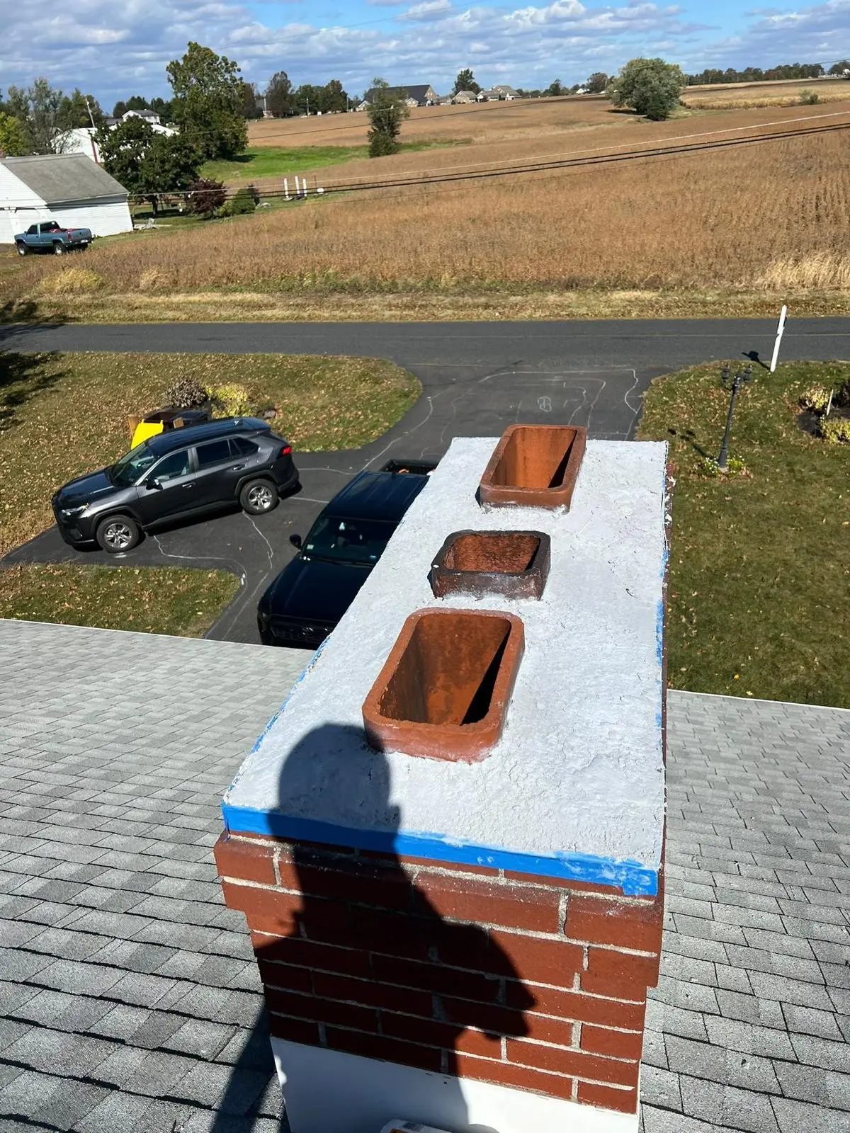 Three-flue chimney on a commercial rooftop
